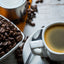 Café Bustelo Espresso Coffee in white cup, Coffee beans on the table.