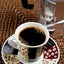 Cafe Santo Domingo Espresso coffee with cup and coffee maker