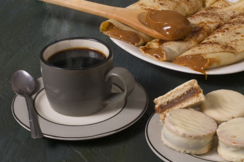 Argentinian traditional breakfast with La Virginia Cafe Instantaneo coffee, alfajores, dulce de leche, pancakes