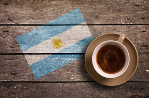 Argentina flag with La Virginia Cafe Torrado Equilibrado Coffee on table